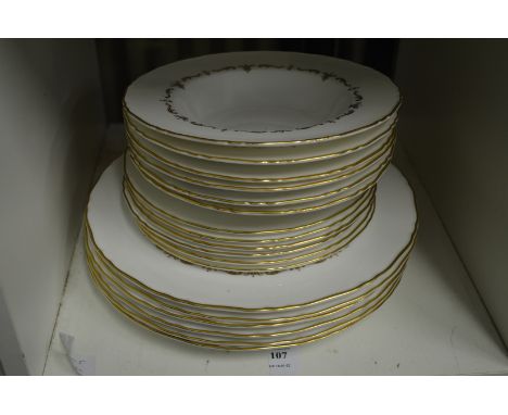 A quantity of Royal Worcester Gold Chantilly soup bowls and plates.