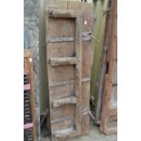 A pair of Indian hardwood doors with wrought iron mounts.