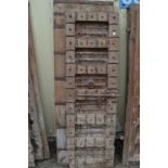 A large Indian hardwood door with wrought iron strap work.