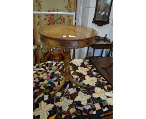 A 19th century mahogany circular drum table, on tripod base.