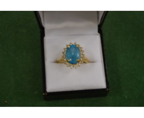 A decorative dress ring stamped 14k.