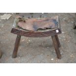 A carved wood stool.
