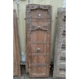 A good large pair of Indian carved hardwood doors with bronze handles.