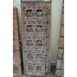 A good large pair of Indian carved hardwood doors with wrought iron strap work and bronze handles.
