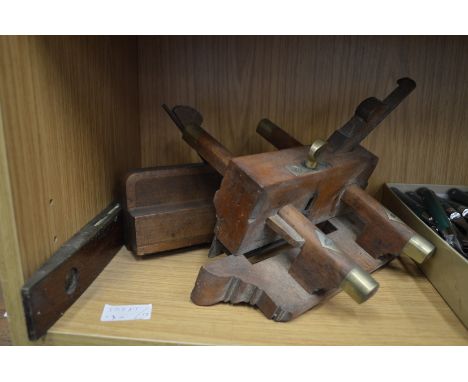 Three old woodworking tools.