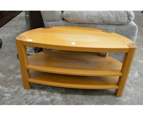 A modern light oak TV stand.
