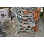 A pair of heavy cast iron bench ends.