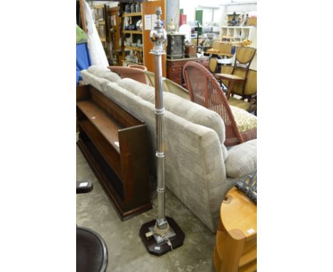 A chrome standard lamp.