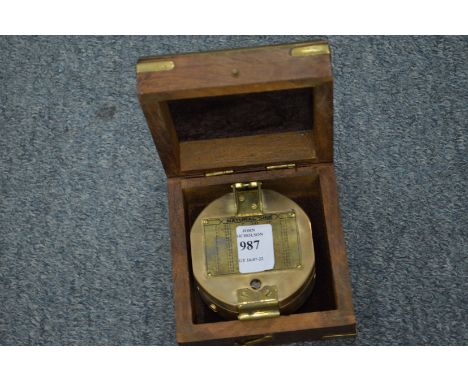 A reproduction compass, boxed.