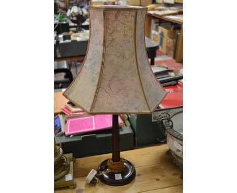 A turned wood lamp base.