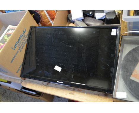 A Panasonic flat screen TV with wall mounted bracket.