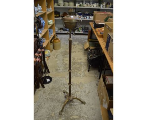 A telescopic copper and brass oil lamp.