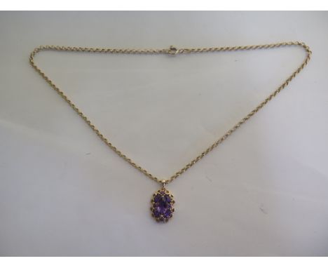 A 14ct amethyst pendant, fully hallmarked to the suspension loop, on a 9ct chain, approx 6.1 grams, one chain link broken oth