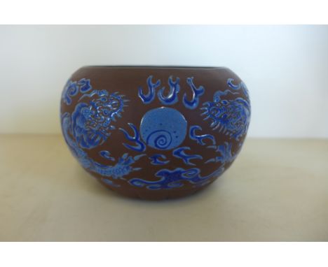 An unusual Yixing gourd-shape bowl, decorated with two dragons, chasing a pearl, 19th/20th century, 12cm diameter, general cr