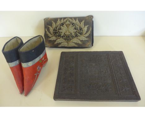 A pair of Chinese bridal shoes, a silver work embroidered evening bag and a Chinese tea block, 24cm x 19cm 