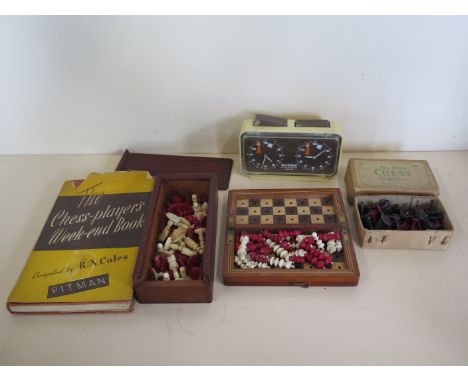 Two bone chess sets, circa 1880  one of the travelling type, together with a boxed The Rose chess set, patent no 546516 - a c