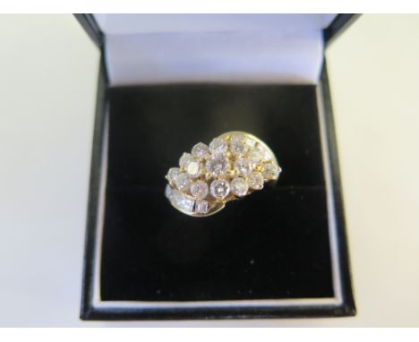 An 18ct diamond cluster ring in yellow gold, 24 diamonds, size M, approx 5.7 grams, in good condition 