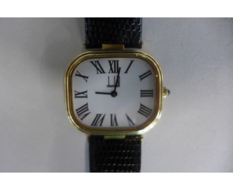 A silver gilt gents Dunhill quartz wristwatch in good condition with new battery, 35mm wide including button 