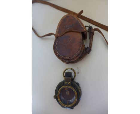 A WWI officers compass, by E R Watts and Son, London, no 940 dated 1915 with Military Mark, with a leather case, stamped 1915