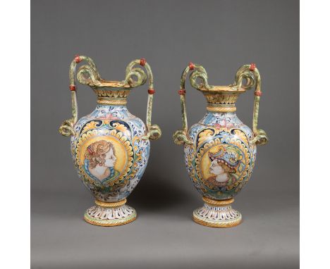 Pair of Large Italian Ceramic Vases, each in amphora shape with snail grips, painted with portraits and ornaments, glazed, a 