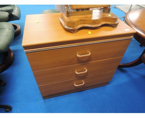 A vintage laminate bedroom chest