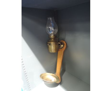 An oak mounted ship light or lamp with brass mounted gimble