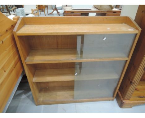 A vintage golden oak bookcase