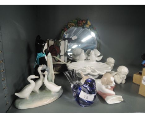 A selection of figures and figurines including Nao and Cherub pair