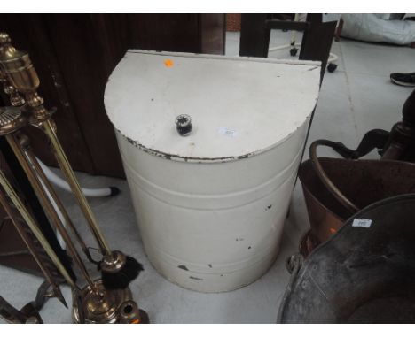 A vintage metal feed bin