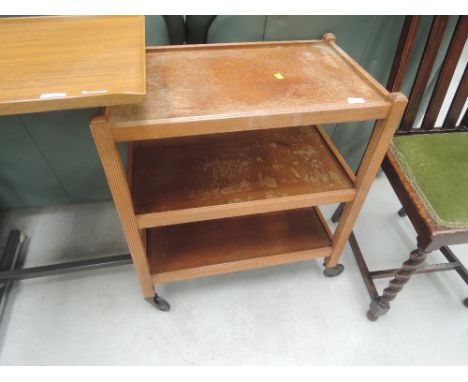A vintage oak tea trolley