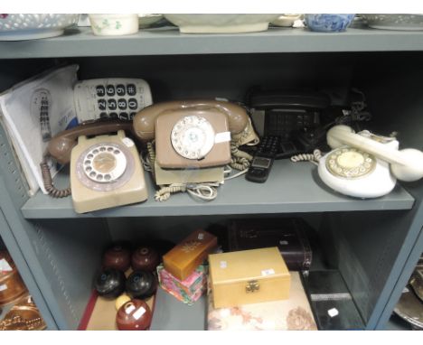 A selection of vintage telephones in various designs and styles