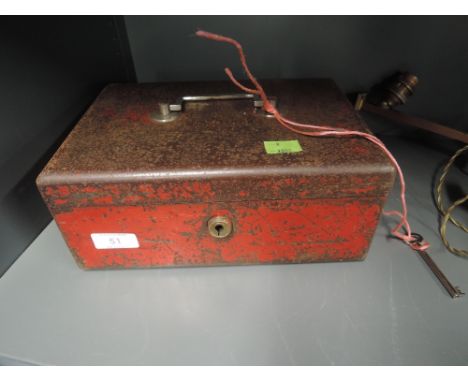 A vintage lockable money box or similar container