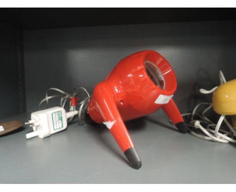A projection lamp with red space age design