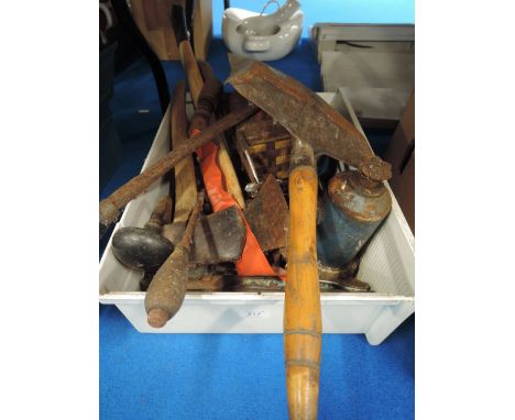 A selection of garage and Diy tools including axes