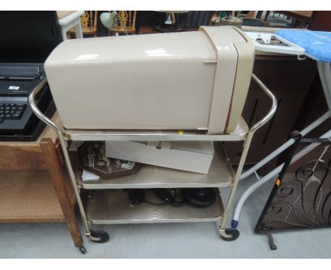 A selection of household items, in vintage tea trolley