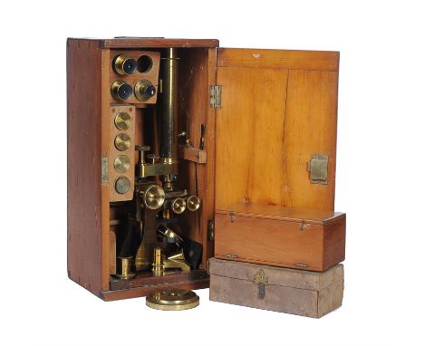 A Victorian lacquered brass binocular microscopeM. P. Tench, London, circa 1870The bifurcated tube of Wenham type with rack a