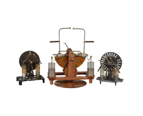 Three Wimshurst pattern electrostatic generating machines, Unsigned, early 20th centuryThe first with twin contra-rotating gl