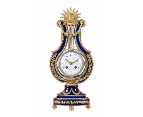 A French Louis XIV style ormolu mounted Sevres style bleu do roi porcelain lyre mantel clockThe dial bearing a signature for 