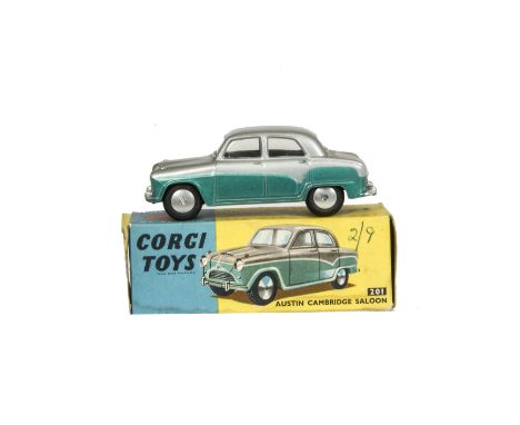 A Corgi Toys 201 Austin Cambridge Saloon, silver over metallic green body, flat spun hubs, in original box with club leaflet,