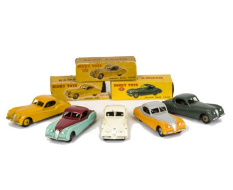 Dinky Toys 157 Jaguar XK120 Coupe, five examples, first yellow body, light yellow hubs, second dark sage green body, fawn hub