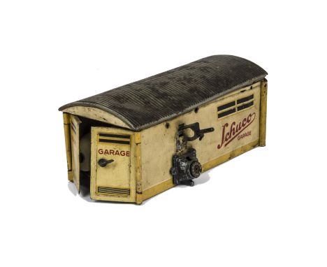 A Schuco Examico 4001 Car and Garage, car in cream, F, chassis loose from body and lacks windscreen, Garage in cream and blac