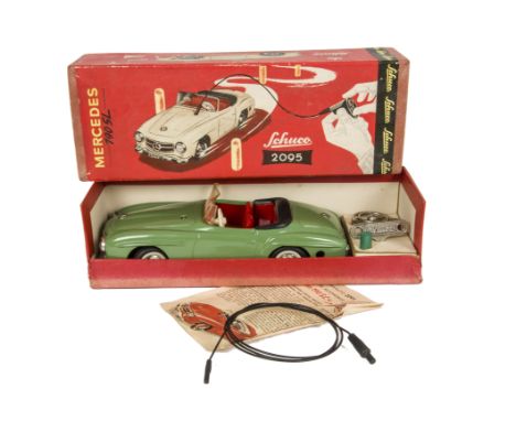 A Schuco 2095 Tinplate Clockwork Remote Control Mercedes 190SL, green body, red interior, black tonneau, in original box with