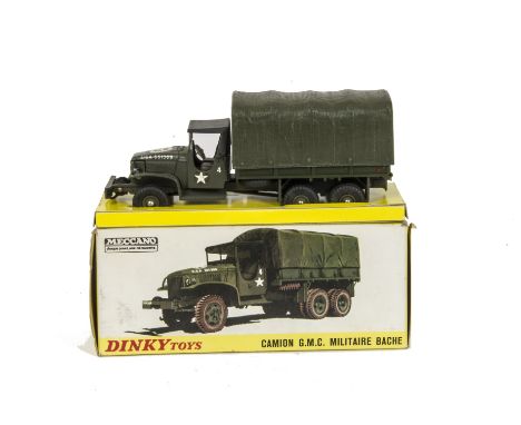 A French Dinky 809 GMC US Army 6x6 Truck, olive drab body, black plastic roof, concave hubs, in original box with inner stand