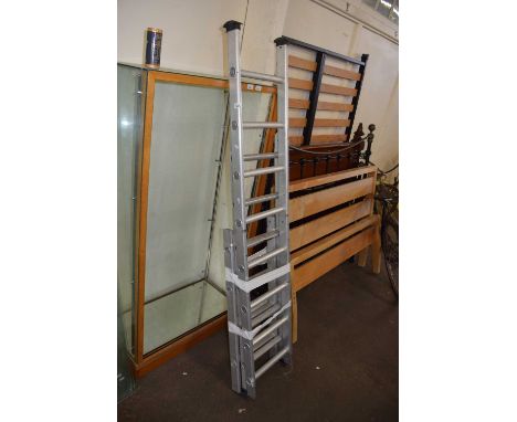 An extending aluminium ladder