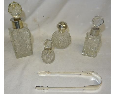 A small cut glass globe Scent Flask with silver cover, three glass Toilet Bottles with silver collars, and a pair of 19th cen
