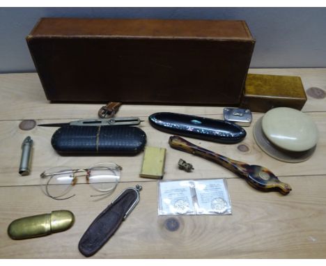 A leather Box and Contents including Victorian glasses case, lighters, folding lorgnette, etc.