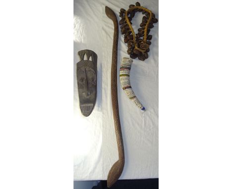 A carved Tribal Stick and other items.