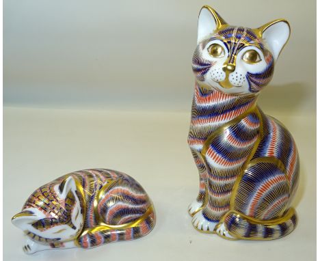 A Royal Crown Derby "The Cat" Paperweight, with ceramic stopper and another of a sleeping kitten with gold stopper. 