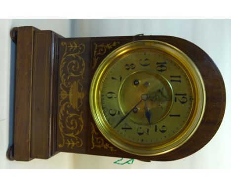A late 19th century Mantle Clock with gilt dial and gong strike in an inlaid mahogany domed case decorated with urns and garl