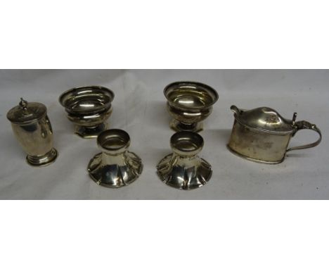 A pair of silver circular Pedestal Salts, Birmingham 1919; a silver oval Mustard Pot with blue glass liner; a silver Pepperet